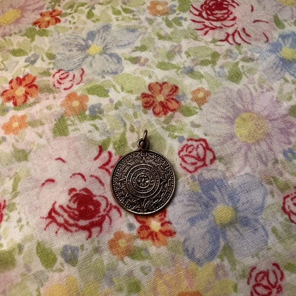 Two charms from southwest roadrunner/turquoise eye,Aztec sun charm